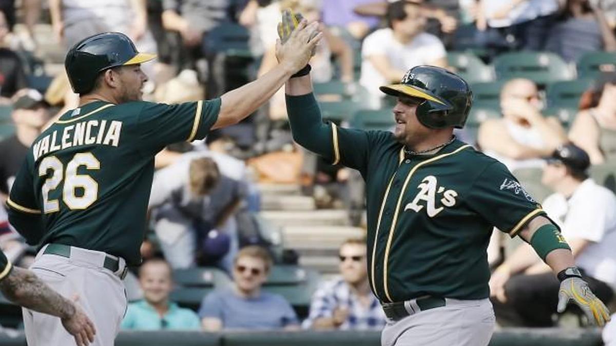 Oakland’s Billy Butler (right) and Danny Valencia are known for their loud banter in the clubhouse and on the field, the San Francisco Chronicle reported.