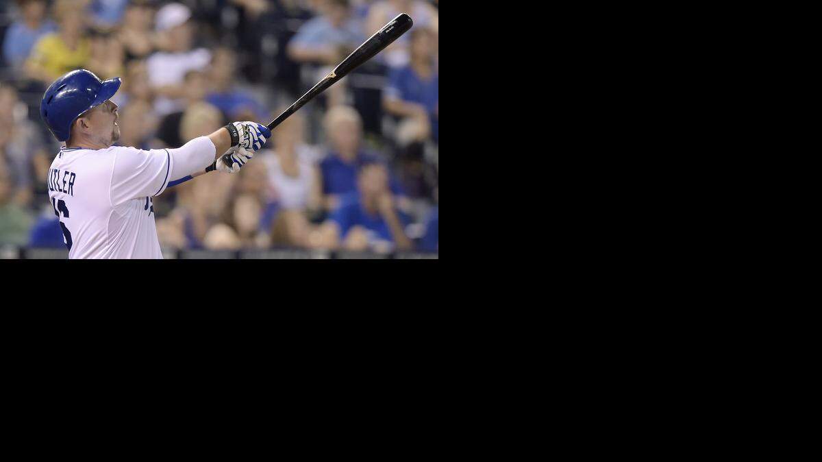 Royals pinch-hitter Billy Butler follows through on a  two-run homer in the eighth inning of Friday's baseball game against the Indians at Kauffman Stadium.