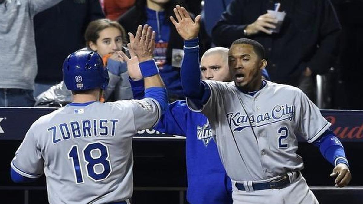 Kansas City Royals shortstop Alcides Escobar celebrated with second baseman Ben Zobrist after Zobrist scored after Eric Hosmer reached on an error in the eighth inning.