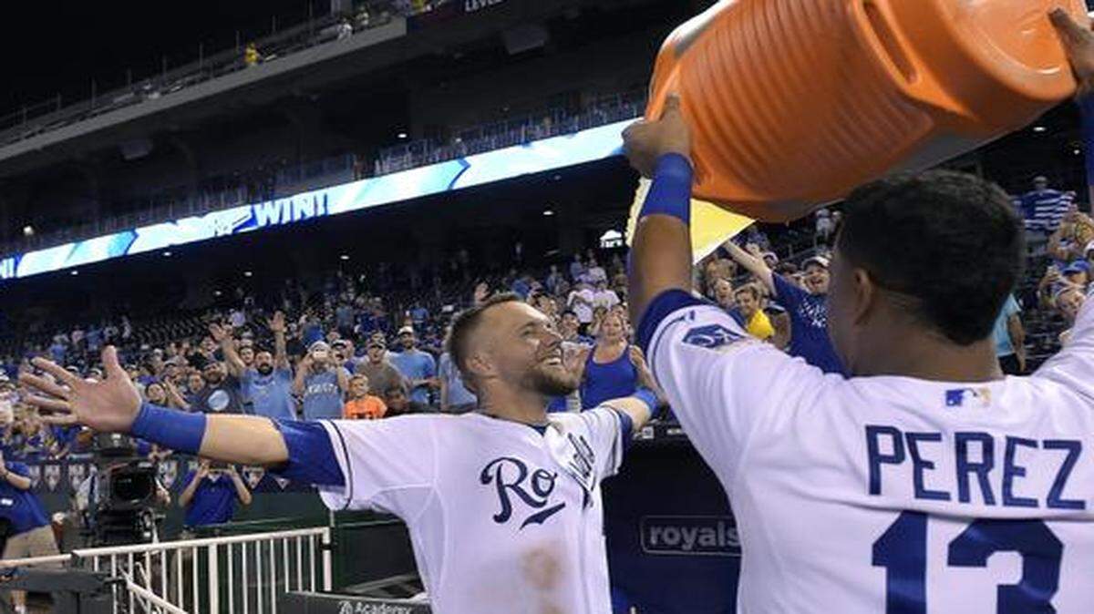 
Alex Gordon prepared to get doused by Salvador Perez after hitting the game-winning two-run home run in the ninth inning Tuesday against Minnesota.
