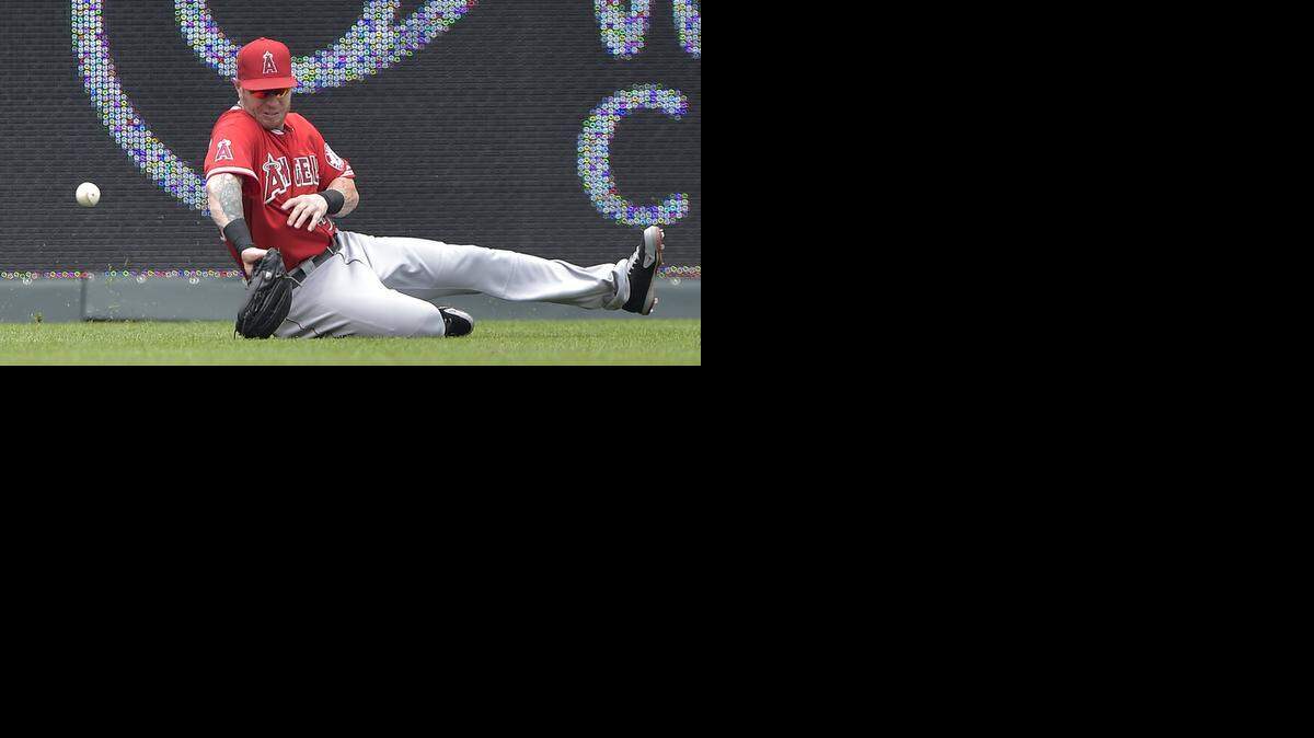 
Los Angeles Angels left fielder Josh Hamilton (32) misses a double by Kansas City Royals' Danny Valencia in the second inning during Sunday's baseball game on June 29, 2014 at Kauffman Stadium in Kansas City, Mo.
