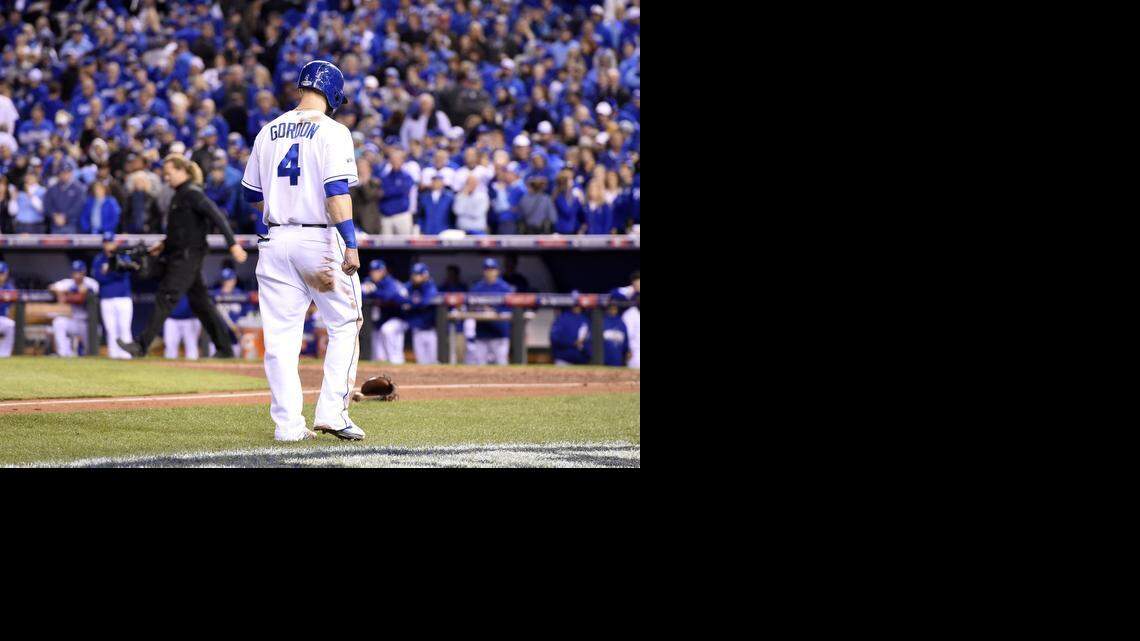 Kansas City Royals left fielder Alex Gordon made a long, lonely walk from third base to the dugout after he was left stranded on third as the possible tying run in the Royals 3-2 loss to the San Francisco Giants in game seven of the World Series on Wednesday, October 29, 2014, at Kauffman Stadium in Kansas City, Mo.