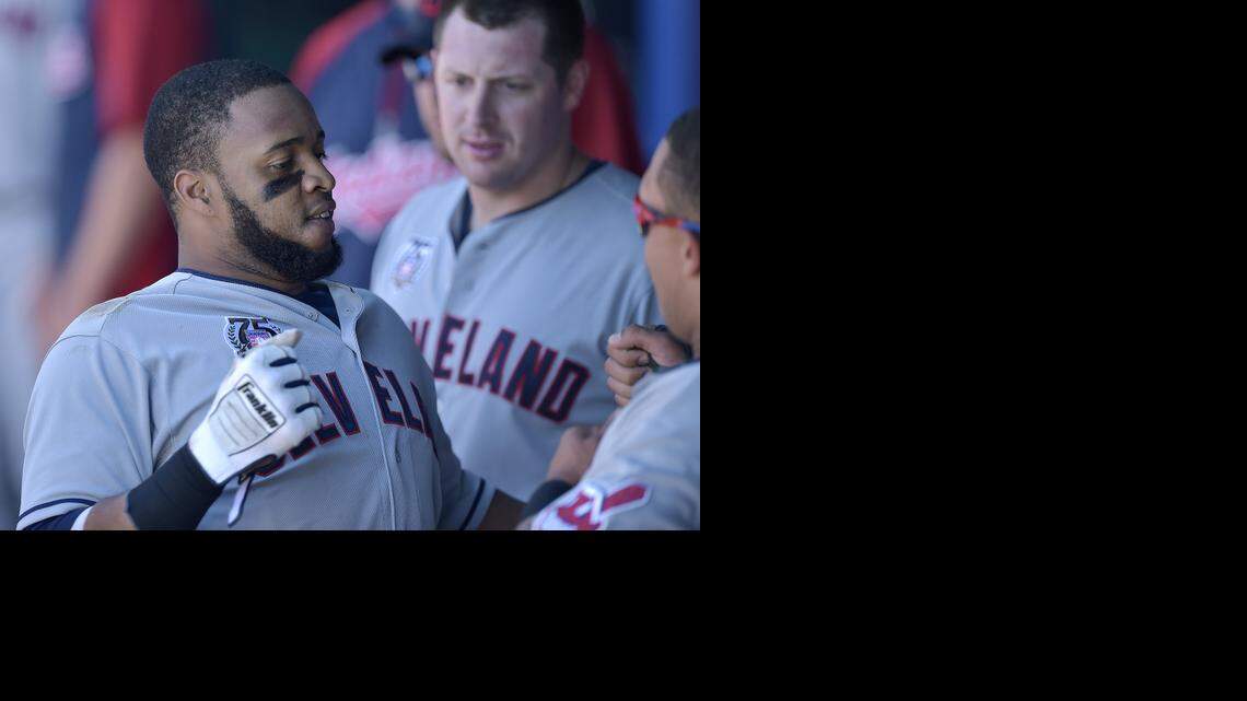 
Cleveland Indians' Carlos Santana (41) celebrates his two run home run in the ninth inning with teammate Michael Brantley (23) in the dugout during Sunday's baseball game against the Kansas City Royals on July 27, 2014, at Kauffman Stadium in Kansas City, Mo.
