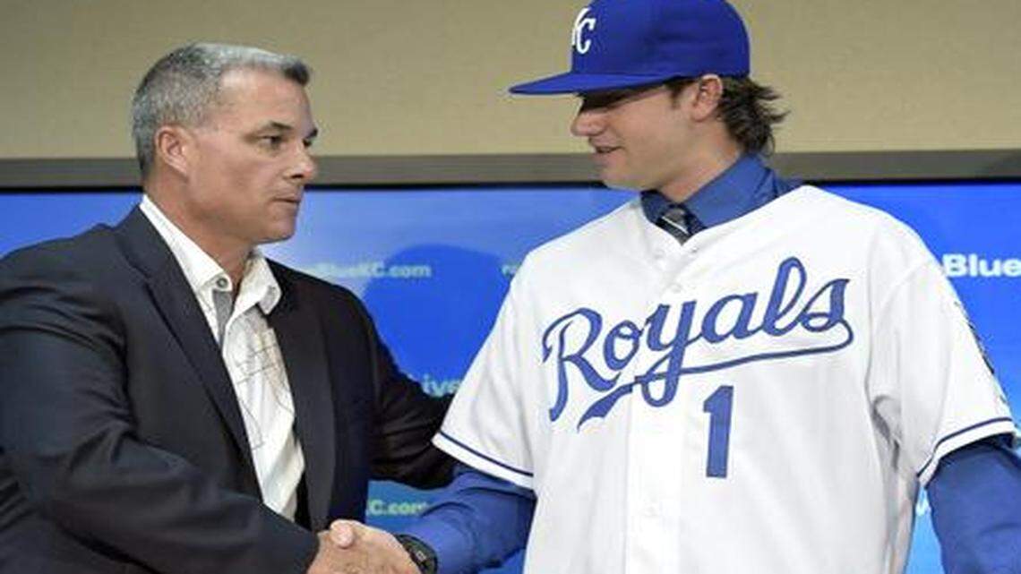 
Brandon Finnegan, the Kansas City Royals first-round draft pick, shook hands with general manager Dayton Moore after putting on a Royals jersey with director of scouting Lonnie Goldberg before Saturday's baseball game at Kauffman Stadium.
