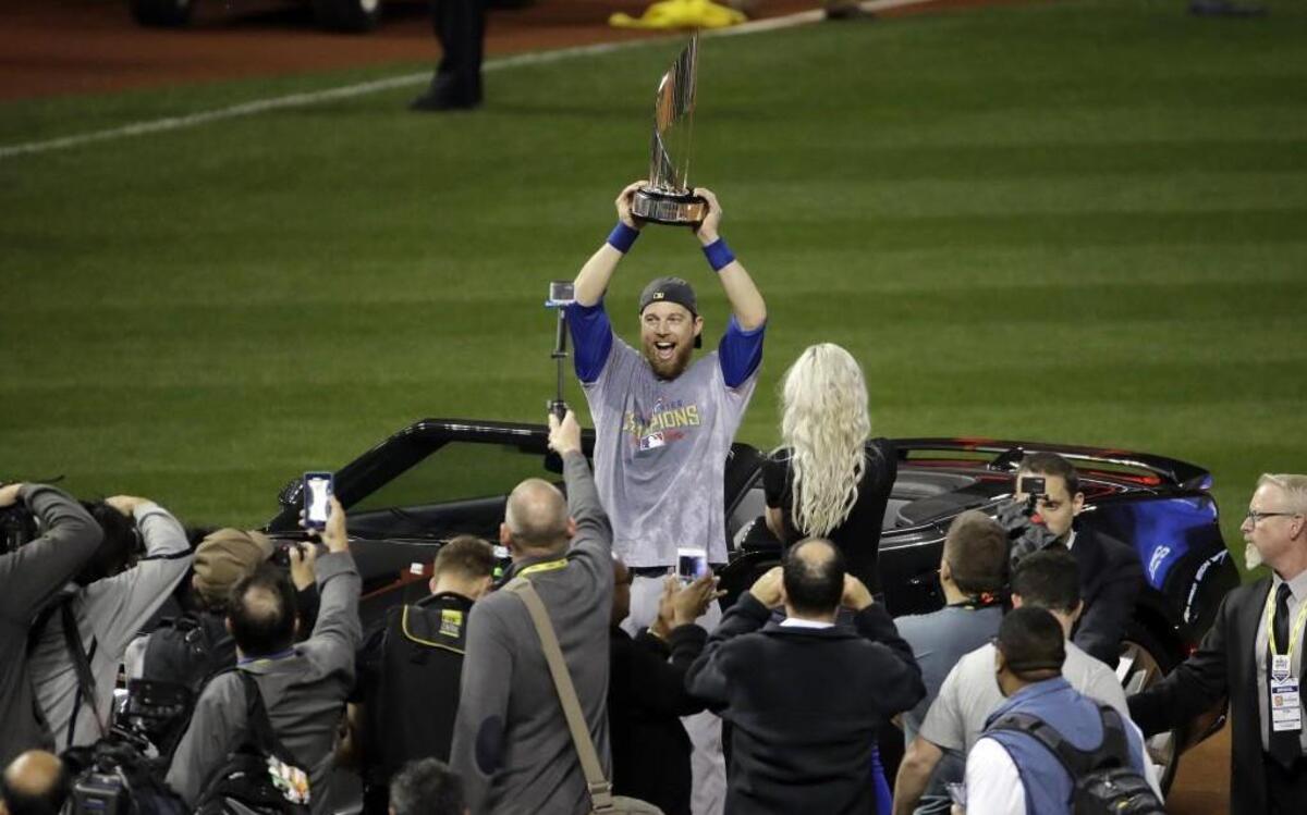 Chicago Cubs left fielder Ben Zobrist celebrated with his MVP trophy after Game 7 of the World Series against the Cleveland Indians.