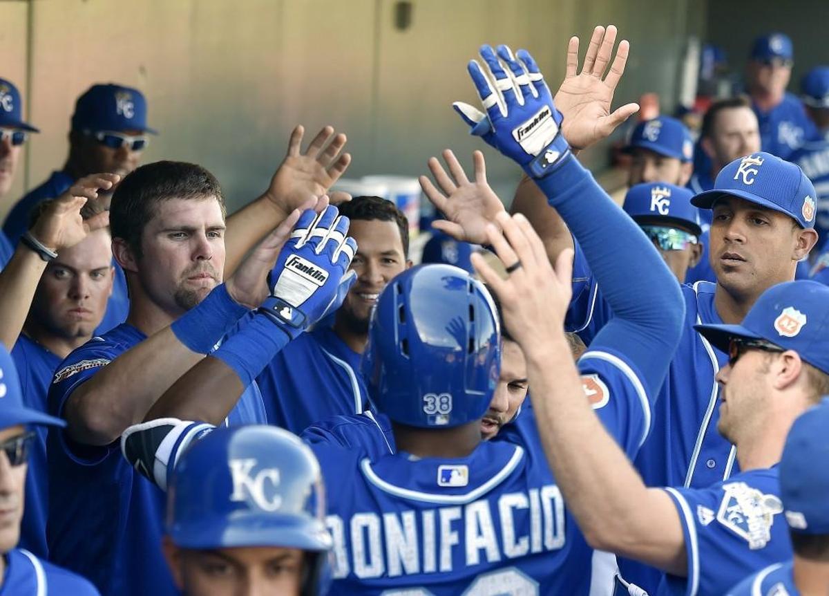 Jorge Bonifacio was congratulated by Bubba Starling, left, and teammates after hitting a solo home run during a spring-training game in 2016.