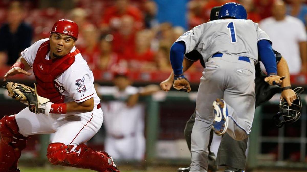 
The Royals’ Jarrod Dyson scored the go-ahead run ahead of Reds catcher Brayan Peña’s tag in the 13th inning on Tuesday night in Cincinnati. The Royals added another run later in the inning and won the game 3-1.

