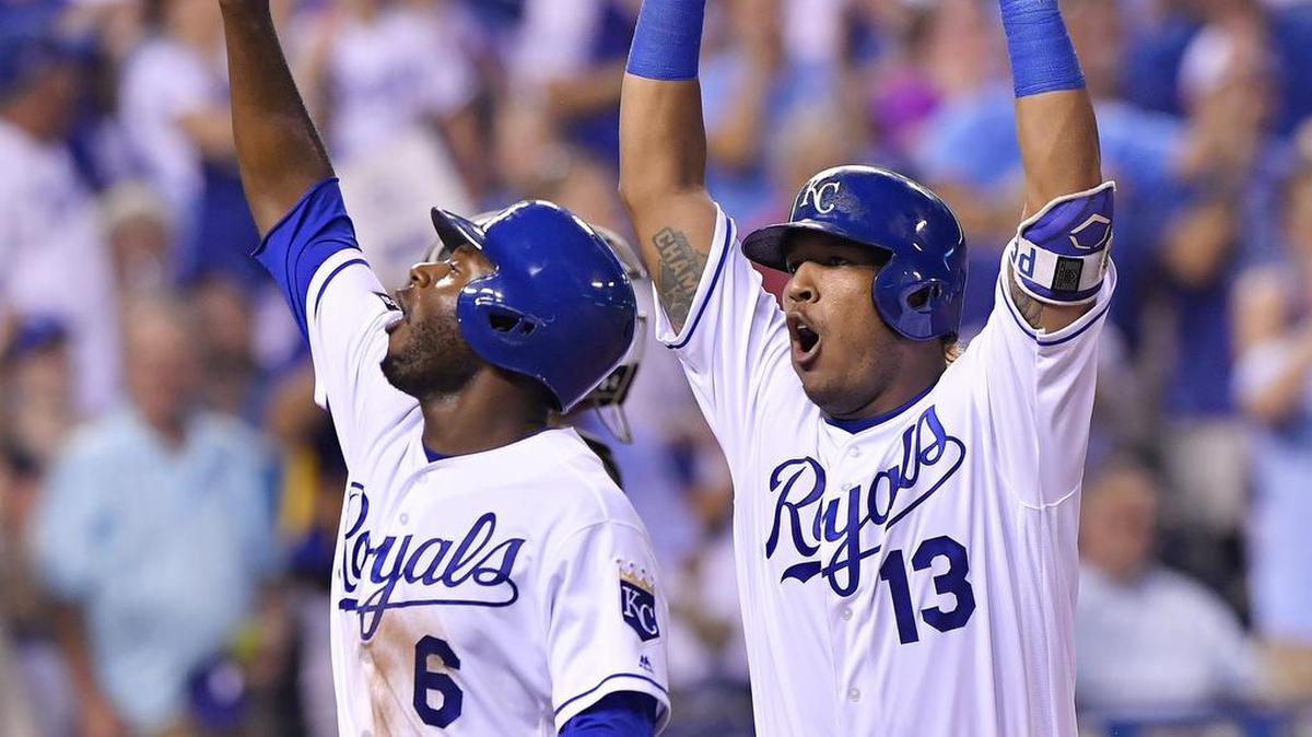 Kansas City Royals' Lorenzo Cain and Salvador Perez celebrate Perez's two-run home run int eh sixth inning during Saturday's baseball game against the Chicago White Sox at Kauffman Stadium in Kansas City, Mo.
