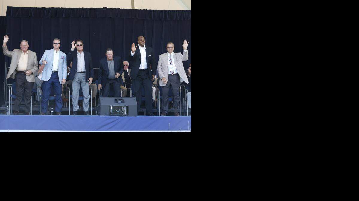 
Baseball Hall of Fame electees Bobby Cox, Tom Glavine, Tony La Russa, Greg Maddux, Frank Thomas and Joe Torre are introduced during an awards ceremony at Doubleday Field on Saturday, July 26, 2014, in Cooperstown, N.Y. They will be inducted on Sunday. (AP Photo/Mike Groll)
