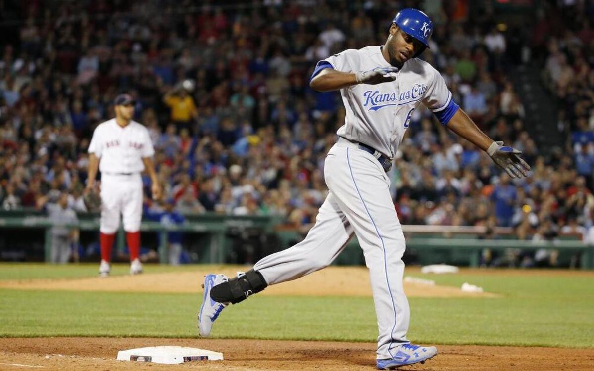 The Royals’ Lorenzo Cain rounded first base after hitting a short three-run home run down the right-field line against the Red Sox’s Eduardo Rodriguez in the fourth inning on Saturday at Fenway Park in Boston.