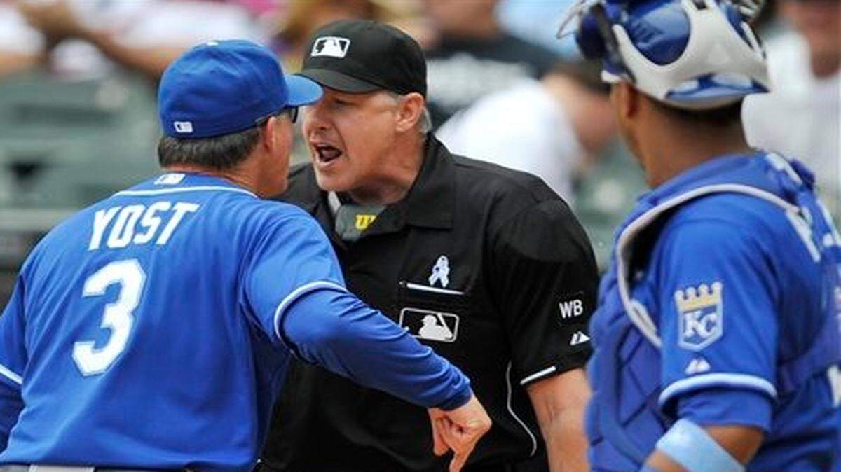 
Royals manager Ned Yost (3), gets ejected Sunday after arguing with home plate umpire Paul Emmel while catcher Salvador Perez watches. Royals pitcher James Shields was called for a balk which scored the White Sox's Adam Eaton during the first inning of Sunday’s baseball game in Chicago

