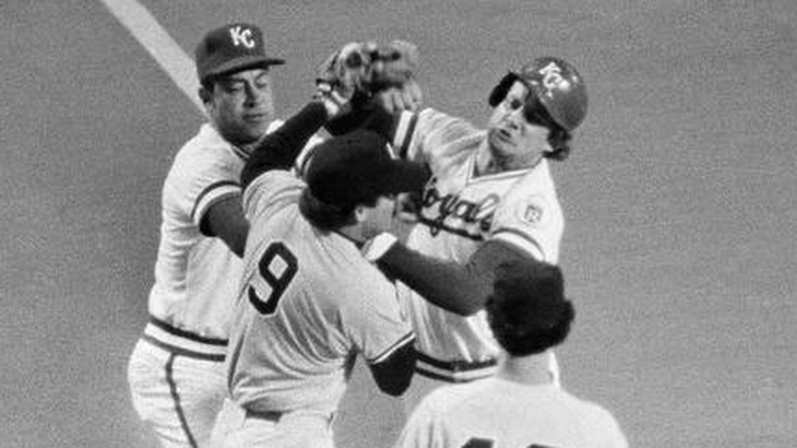 The Royals’ George Brett swung at Yankees third baseman Graig Nettles after hitting an RBI triple in first inning of Game 5 of the American League Championship Series in Kansas City. The umpire was Marty Springstead (right). Yankees pitcher Ron Guidry (49) watched as Royals coach Chuck Hiller (top left) tried to break up the scuffle.