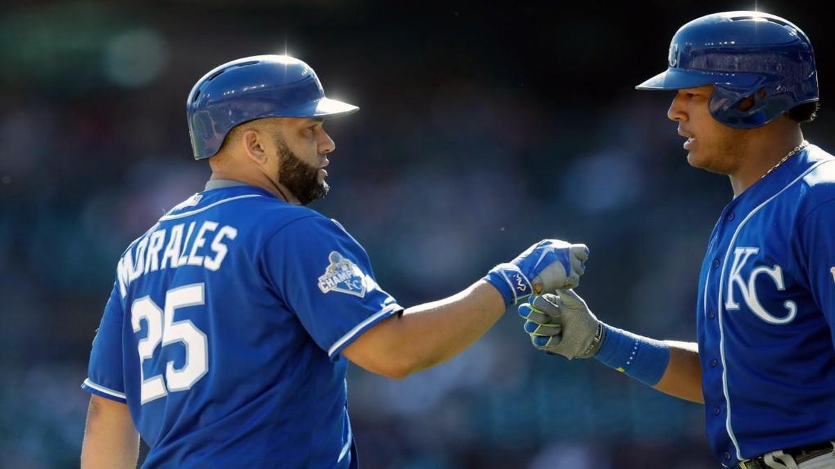In a 7-4 victory over the Tigers, Kendrys Morales (left) yanked a solo homer off Tigers starter Daniel Norris in the top of the sixth, becoming the first Royals player to hit 30 homers since Jermaine Dye in 2000. Teammate Salvador Perez congratulated Morales at home plate.