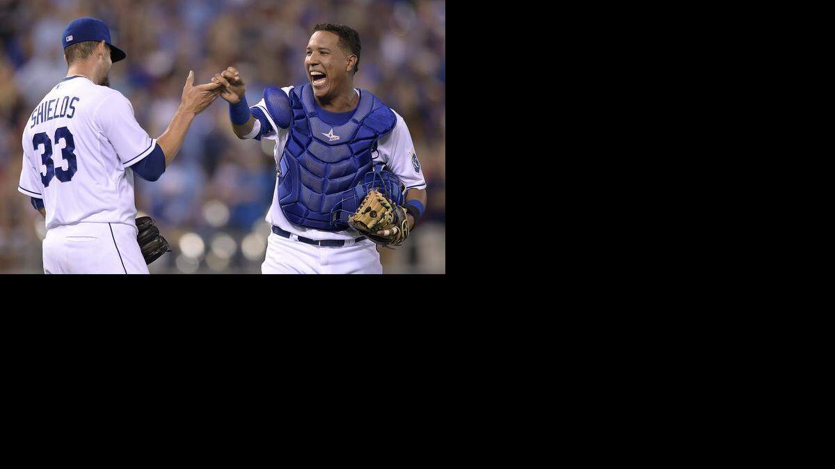 
Kansas City Royals catcher Salvador Perez (13) congratulates starting pitcher James Shields (33) on his complete game shutout for a 5-0 win over the San Francisco Giants during Saturday's baseball game on August 9, 2014 at Kauffman Stadium in Kansas City, Mo.
