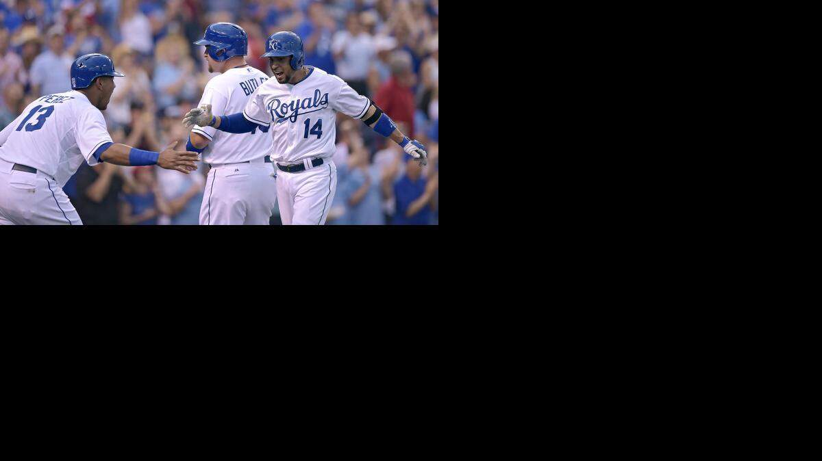 
Kansas City Royals' Omar Infante (14) celebrates his grand slam in the third inning off Los Angeles Angels starting pitcher Matt Shoemaker with Salvador Perez (13) and Billy Butler (16) during Friday's baseball game on June 27, 2014 at Kauffman Stadium in Kansas City, Mo.
