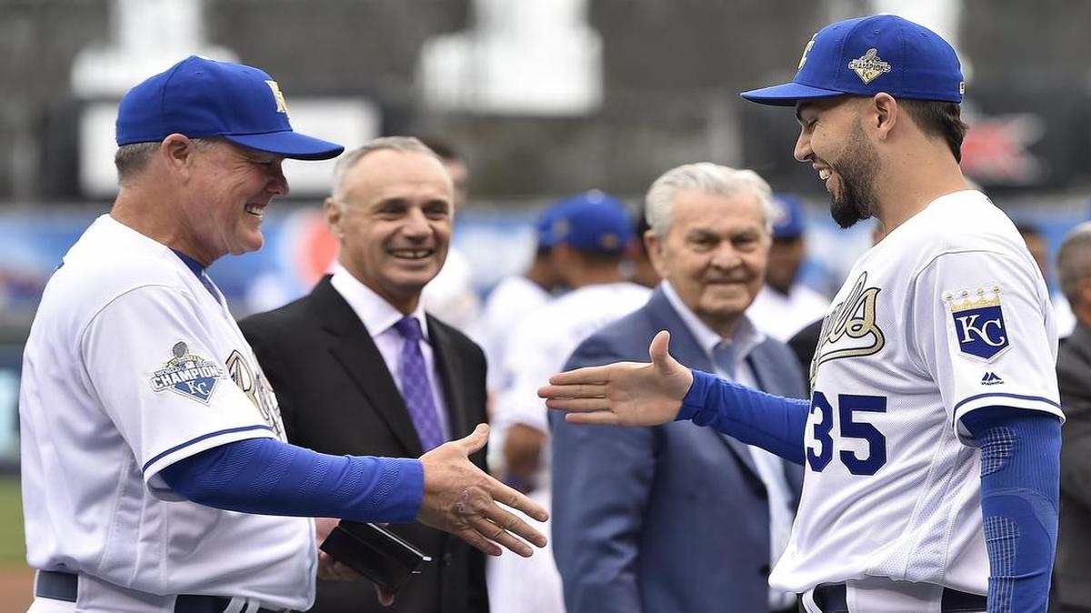 Royals manager Ned Yost (left) handed out a championship ring to first baseman Eric Hosmer as baseball commissioner Rob Manfred (second from left) and Royals owner David Glass looked on during a ceremony on Apr. 5, 2016, at Kauffman Stadium. Hosmer is one of the players who could be leaving the Royals in free agency this offseason.
