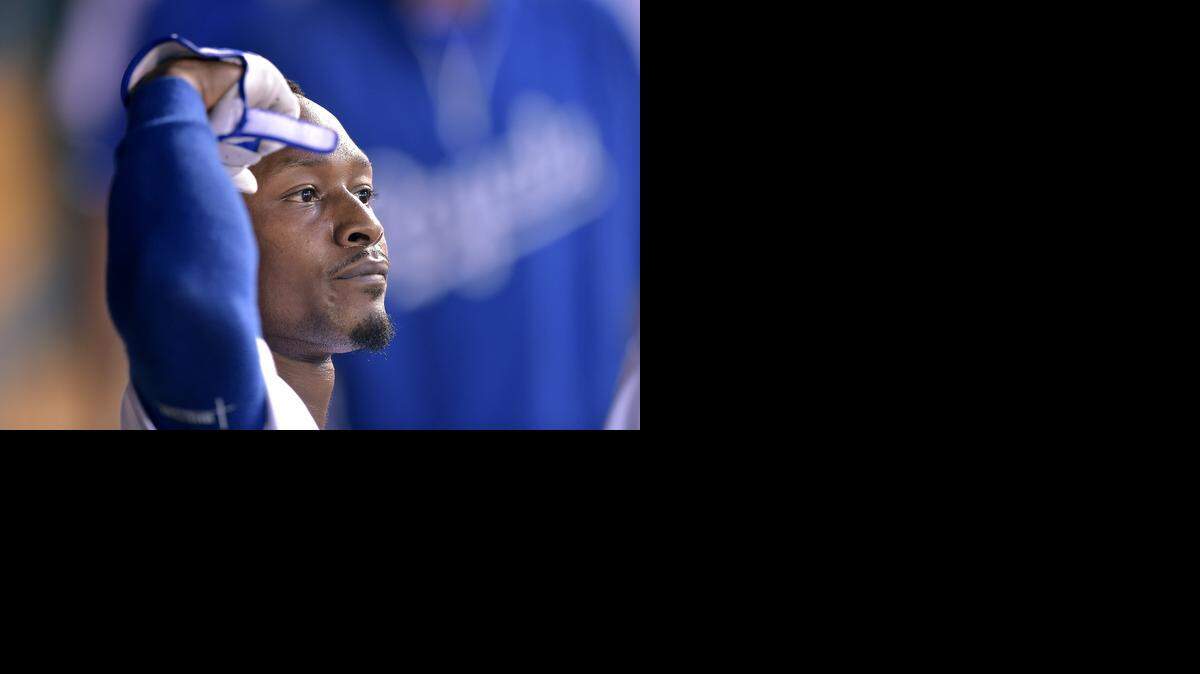 
Kansas City Royals' Jarrod Dyson (1) displays his muscle arm in the dugout after hitting a solo home run in the fifth inning during Wednesday's baseball game against the Los Angeles Dodgers on June 25, 2014 at Kauffman Stadium in Kansas City, Mo.
