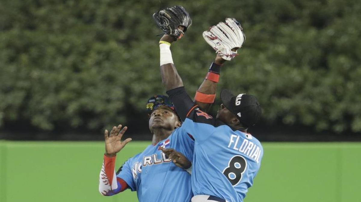 World team right fielder Estevan Florial (right) and left fielder Mauricio Dubon went after a fly ball hit by the U.S. team’s Scott Kingery in the seventh inning of the All-Star Futures Game on Sunday in Miami.