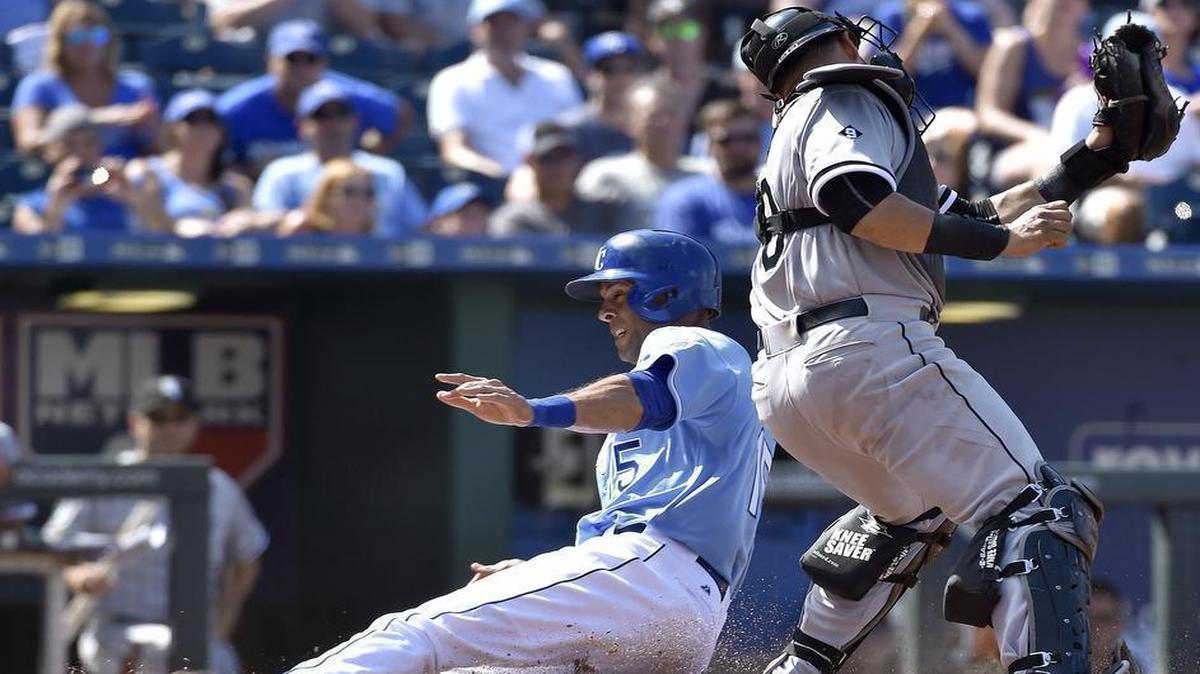 
The Royals’ Alex Rios (15) scored ahead of the tag from Chicago catcher Tyler Flowers on a fielder’s choice RBI by Omar Infante in the eighth inning Sunday at Kauffman Stadium. The run proved to be the winning margin in the Royals’ 5-4 win over the White Sox.
