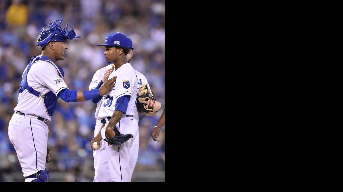 
Kansas City Royals pitcher Yordano Ventura got some encouragement from catcher Salvador Perez during the sixth inning of Tuesday’s Wild Card Game. Ventura didn’t last the inning, but he will be starting Game 2 of the ALDS on Friday against the Angels.
