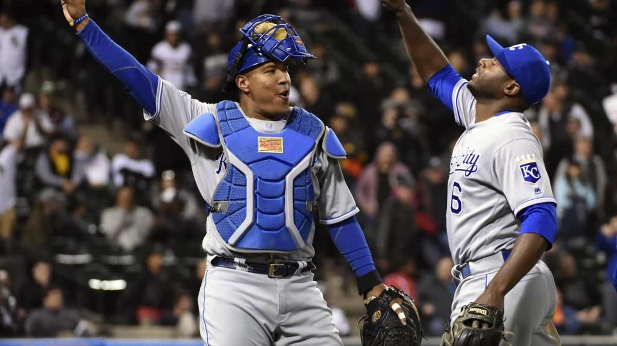 Kansas City Royals catcher Salvador Perez (13) and Kansas City Royals center fielder Lorenzo Cain (6) celebrate their 4-1 win against the Chicago White Sox Friday, May 20, 2016, in Chicago.