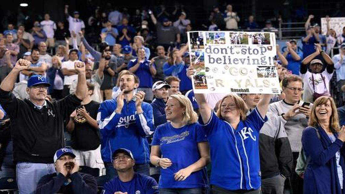 
Kansas City Royals fans Jennifer Bendorf (left center) and her sister Marilyn Kirn (holding poster), both from Lee’s Summit, celebrated with the crowd after the team’s 6-2 win over the Chicago White Sox on Wednesday at Kauffman Stadium.
