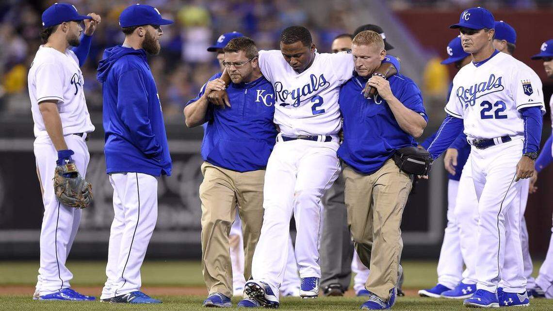 
Kansas City Royals shortstop Alcides Escobar (2) was helped off the field after being injured on a slide by Oakland’s Brett Lawrie on Friday at Kauffman Stadium in Kansas City, Mo.
