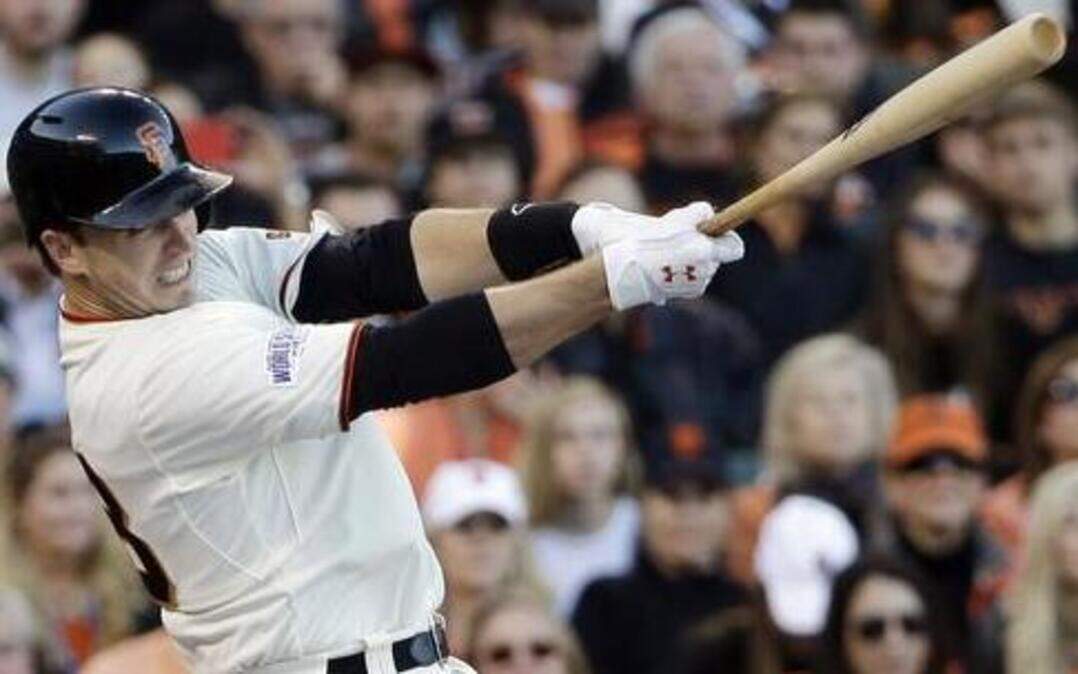 
The Giants’ Buster Posey hit a single in the first inning of game five of the World Series against the Kansas City Royals on Sunday night at AT&T Park in San Francisco. 
