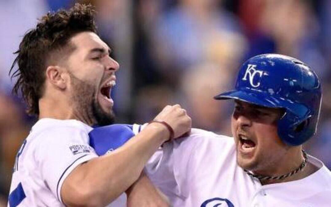
Royals first baseman Eric Hosmer (left )was waiting to congratulate designated hitter Billy Butler when Butler came in to score in the first inning off an Alex Gordon double in Sunday’s American League Division Series game at Kauffman Stadium.
