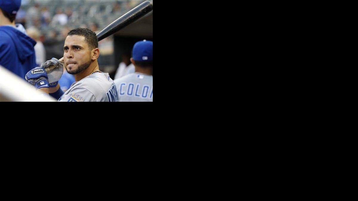 
Kansas City Royals second baseman Omar Infante looks out of the dugout before the first inning of a baseball game against the Minnesota Twins in Minneapolis, Monday, Aug. 18, 2014. (AP Photo/Ann Heisenfelt)
