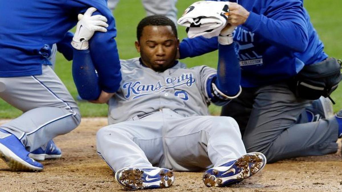 
Trainers helped the Royals’ Alcides Escobar after he was struck in the head by a pitch from the Indians’ Danny Salazar while batting in the top of the fifth inning Wednesday night in Cleveland. Escobar left the game.
