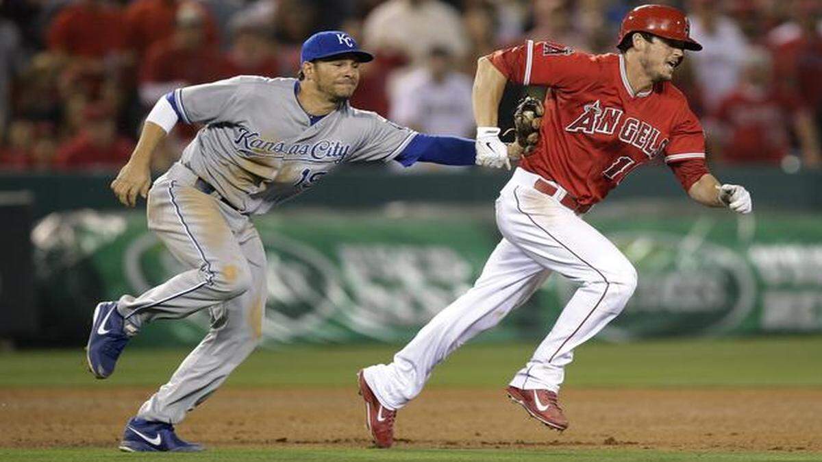 
The Angels' Grant Green was tagged out by Royals third baseman Danny Valencia as he tried to advance to third after hitting a double during Friday’s game in Anaheim, Calif.
