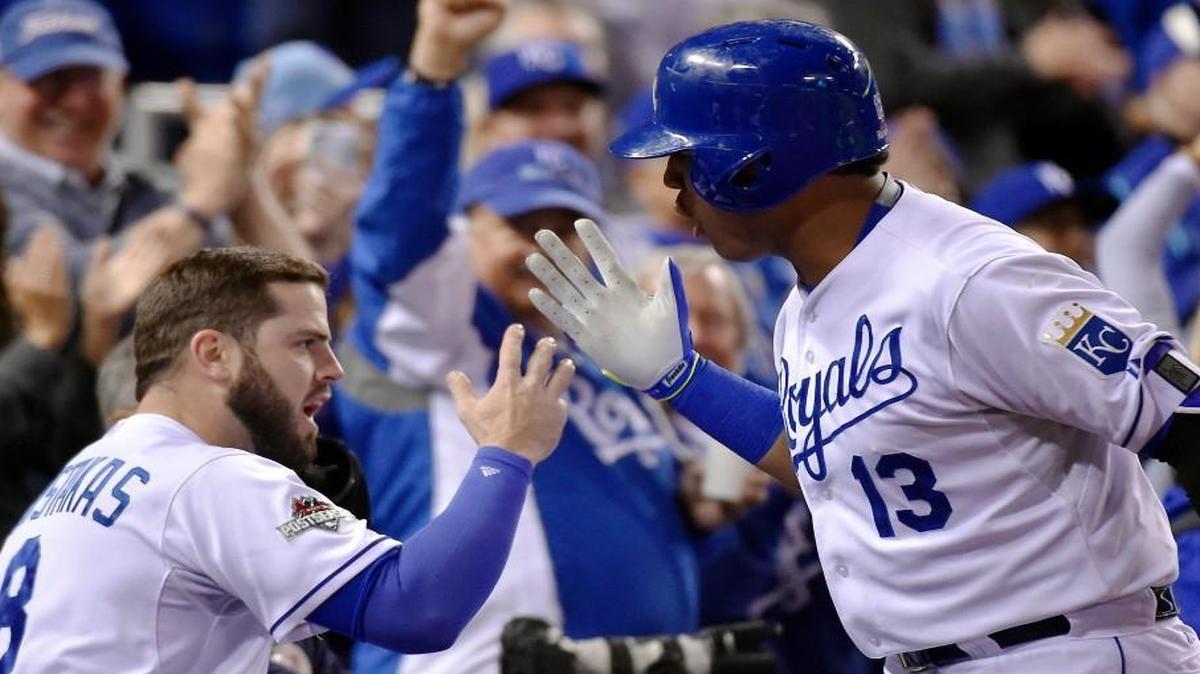 
 Royals third baseman Mike Moustakas celebrated with catcher Salvador Perez after Perez hit a solo homer in the fourth inning of Friday's ALCS baseball game at Kauffman Stadium.
