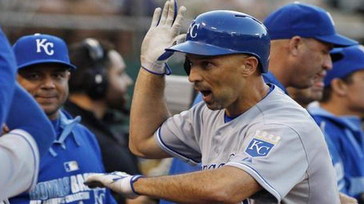 
The Royals' Raul Ibanez was greeted in the dugout after hitting what turned out to be the game-winning home run against the Athletics during Friday’s game in Oakland.
