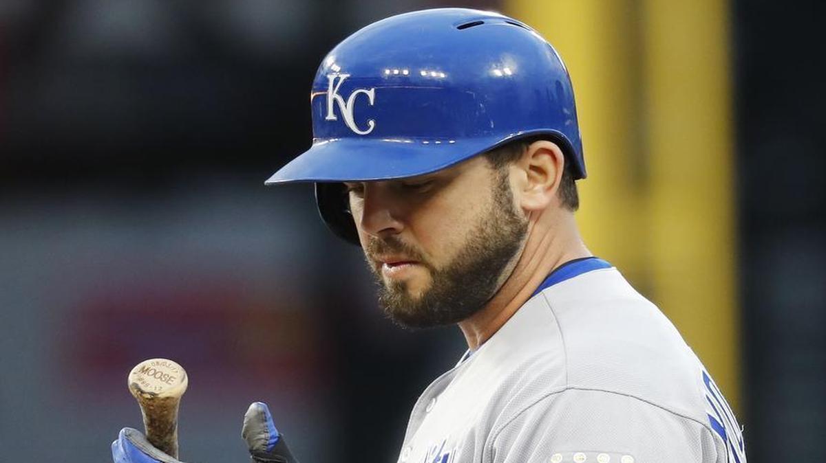 The Royals’ Mike Moustakas looked at his broken bat handle while standing on first base after hitting a single against the Tigers in the second inning Wednesday in Detroit. Moustakas exited in the seventh inning after sustaining what the Royals termed “right lateral knee irritation.”