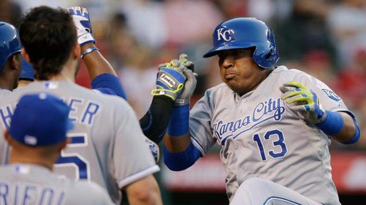 
Salvador Perez (right) celebrated his two-run home run in the fourth inning against the Los Angeles Angels on Saturday night in Anaheim, Calif.
