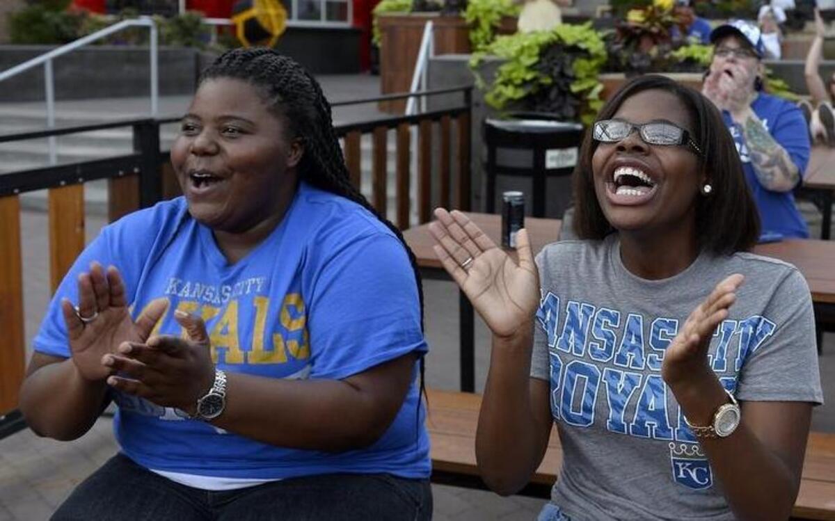 
Despite the heat, Royals fans came out to the Power & Light District to watch the All-Star Game on Tuesday night. Jherica Cox of Kansas City and her niece, Taylor Maryland of Hammond, La., cheered as Royals players were introduced.
