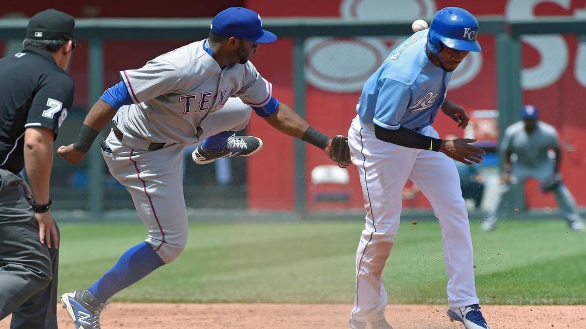 
The Royals' Jarrod Dyson (1) steals second as the ball bounces away from Rangers shortstop Hanser Alberto (68), allowing Dyson to advance to third base in the third inning of Saturday's baseball game at Kauffman Stadium.
