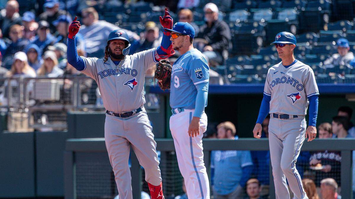 Toronto Blue Jays first baseman Vladimir Guerrero Jr. (27) makes a signal to teammates during the first inning against the Kansas City Royals at Kauffman Stadium on April 6, 2023.