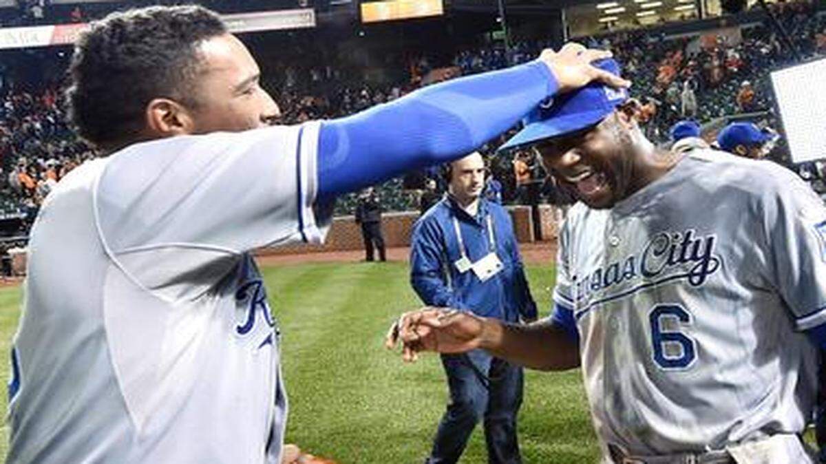 
The Royals’ Salvador Perez (13) and Lorenzo Cain (6) celebrated their team’s 6-4 win over the Baltimore Orioles in game two of the American League Championship Series on Saturday night in Baltimore.

