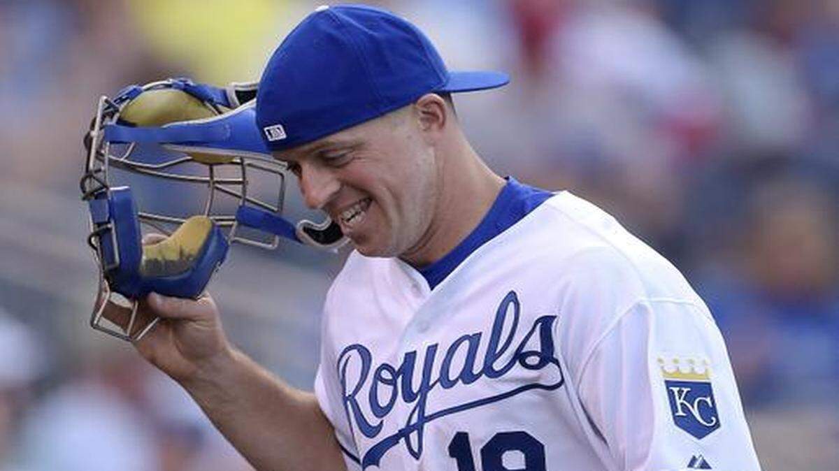 
Kansas City Royals catcher Erik Kratz (19) warms up the pitcher for catcher Salvador Perez before the second inning during Tuesday's baseball game against the Minnesota Twins on July 29, 2014, at Kauffman Stadium in Kansas City, Mo.
