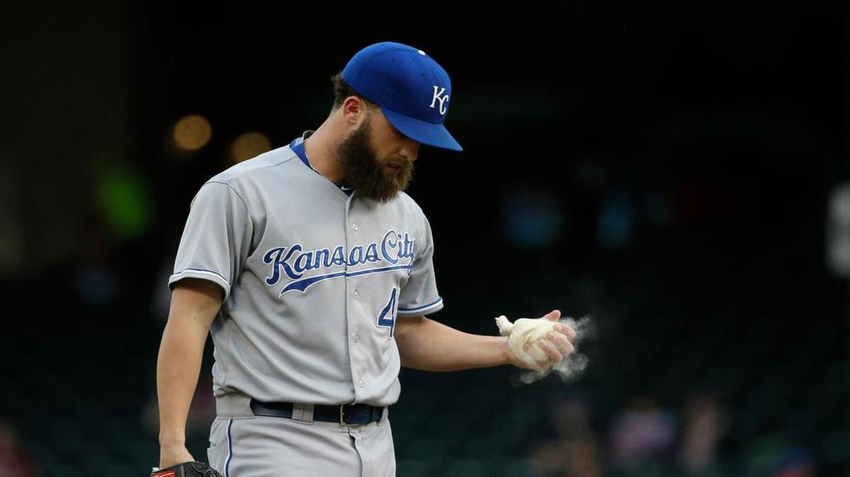 
Royals starting pitcher Danny Duffy grabs the rosin bag during the first inning of Monday’s baseball game against the Rangers in Arlington, Texas.
