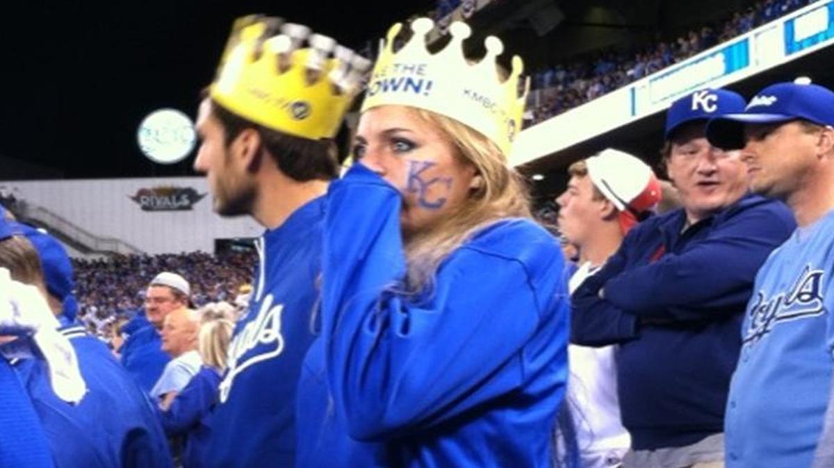 
Even before the game began, Abby Kolich, 27, of Olathe was on her feet, gold paper crown on her head, biting her fingers in anticipation.
