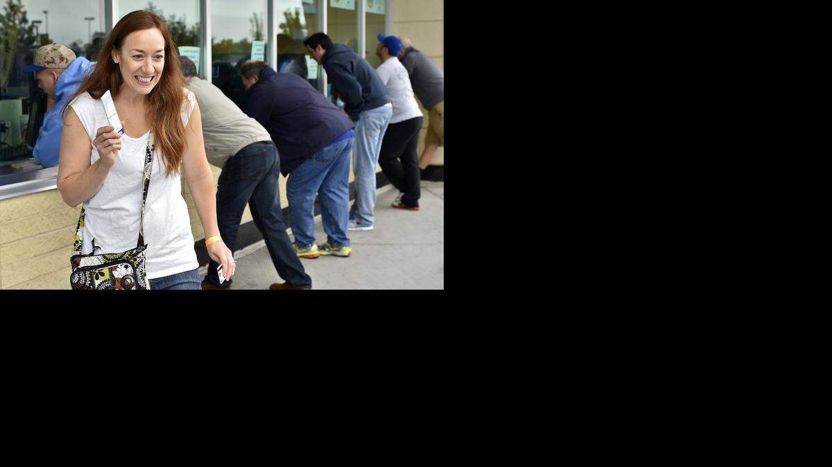 
Even before fans knew if the Royals would make it to the postseason, they lined up to buy tickets at Kauffman Stadium. Michelle Madison of Overland Park was among those fans on Sept. 18. Now that the Royals are officially in the postseason, ticket prices have skyrocketed.
