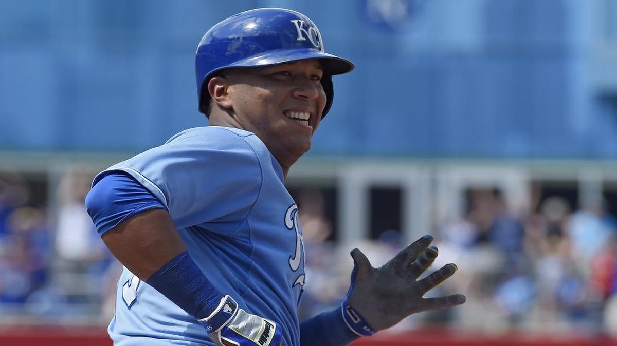 
Salvador Perez smiled as he rounded the bases after hitting a solo home run that broke a 3-3 tie with the Texas Rangers on Sunday at Kauffman Stadium. Closer Greg Holland protected the lead in the ninth, and the Royals won 4-3 to avoid a sweep in the three-game series.
