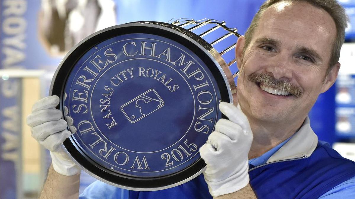 Curt Nelson, director of the Royals Hall of Fame, showed the bottom of the Royals’ 2015 World Series trophy Thursday after it was returned from cleaning and engraving at Tiffany & Co.