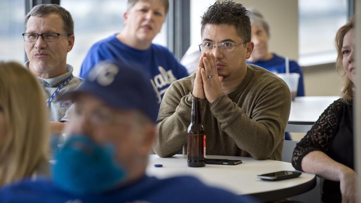 
Employees of Bryan Cave law firm, including Charles Flores (right), tensely watched Friday as the Royals got into a jam in the second inning of their game with the Houston Astros. They gathered to watch the game in a dining room of their offices in One Kansas City Place, 1200 Main St. Flores works in information technology for the firm.


