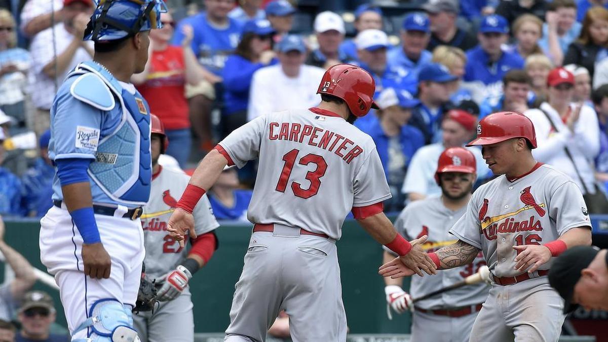 
Teammate Kolten Wong (16) congratulated the Cardinals’ Matt Carpenter (13) after Carpenter hit a two-run home run in the sixth inning Sundayagainst the Royals at Kauffman Stadium. St. Louis won the game 6-1 to avoid a sweep in the three-game interleague series
