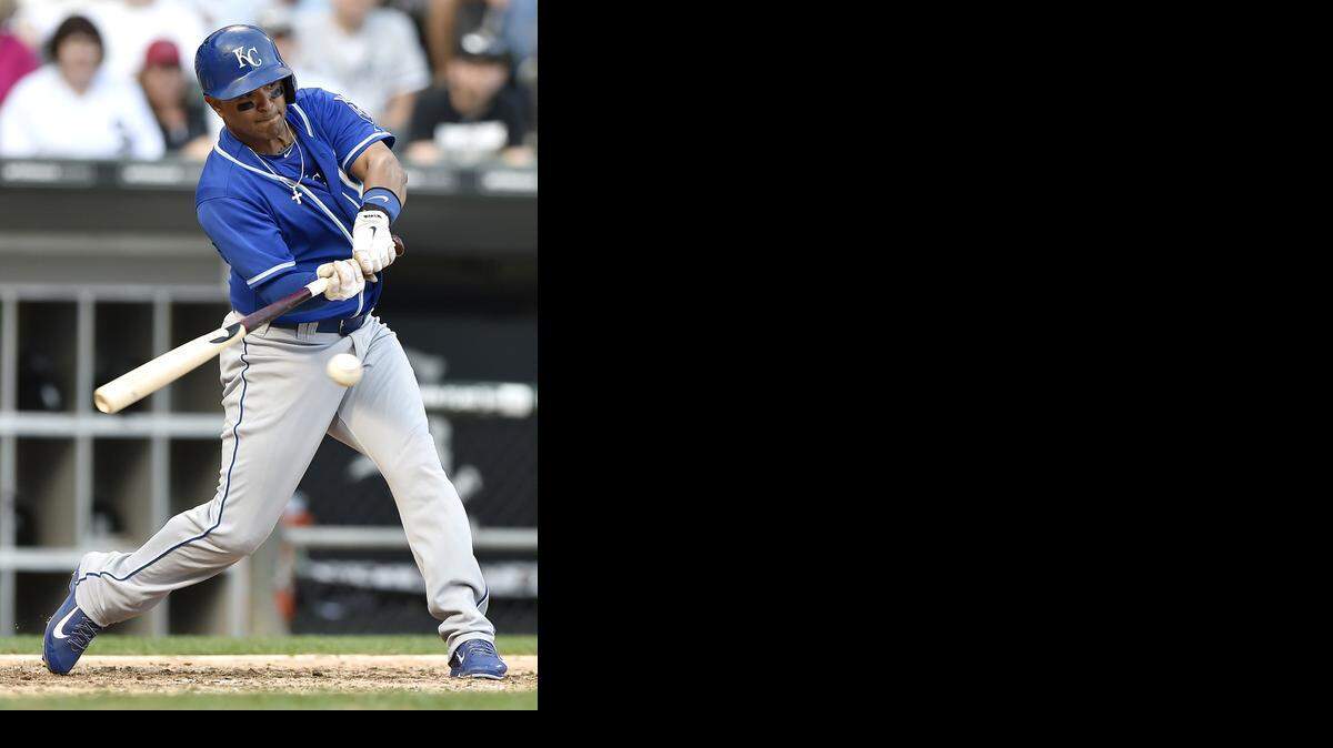 
Kansas City Royals' Christian Colon (24) connects on a single in the eighth inning during Sunday's baseball game against the Chicago White Sox on September 28, 2014 at U.S. Cellular Field in Chicago, Ill.
