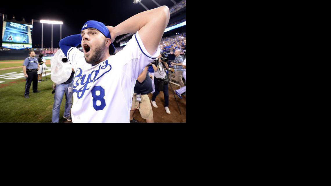 
Kansas City Royals third baseman Mike Moustakas (8) has a look of astonishment as the celebration continues during the Kansas City Royals and Oakland Athletics baseball game at Kauffman Stadium on Tuesday, September 30, 2014, in Kansas City, Missouri. Royals won 9-8.

